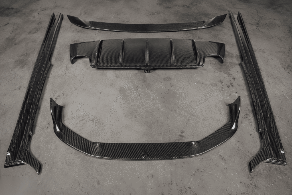 Multi-piece carbon fiber body kit with consistent weave matching