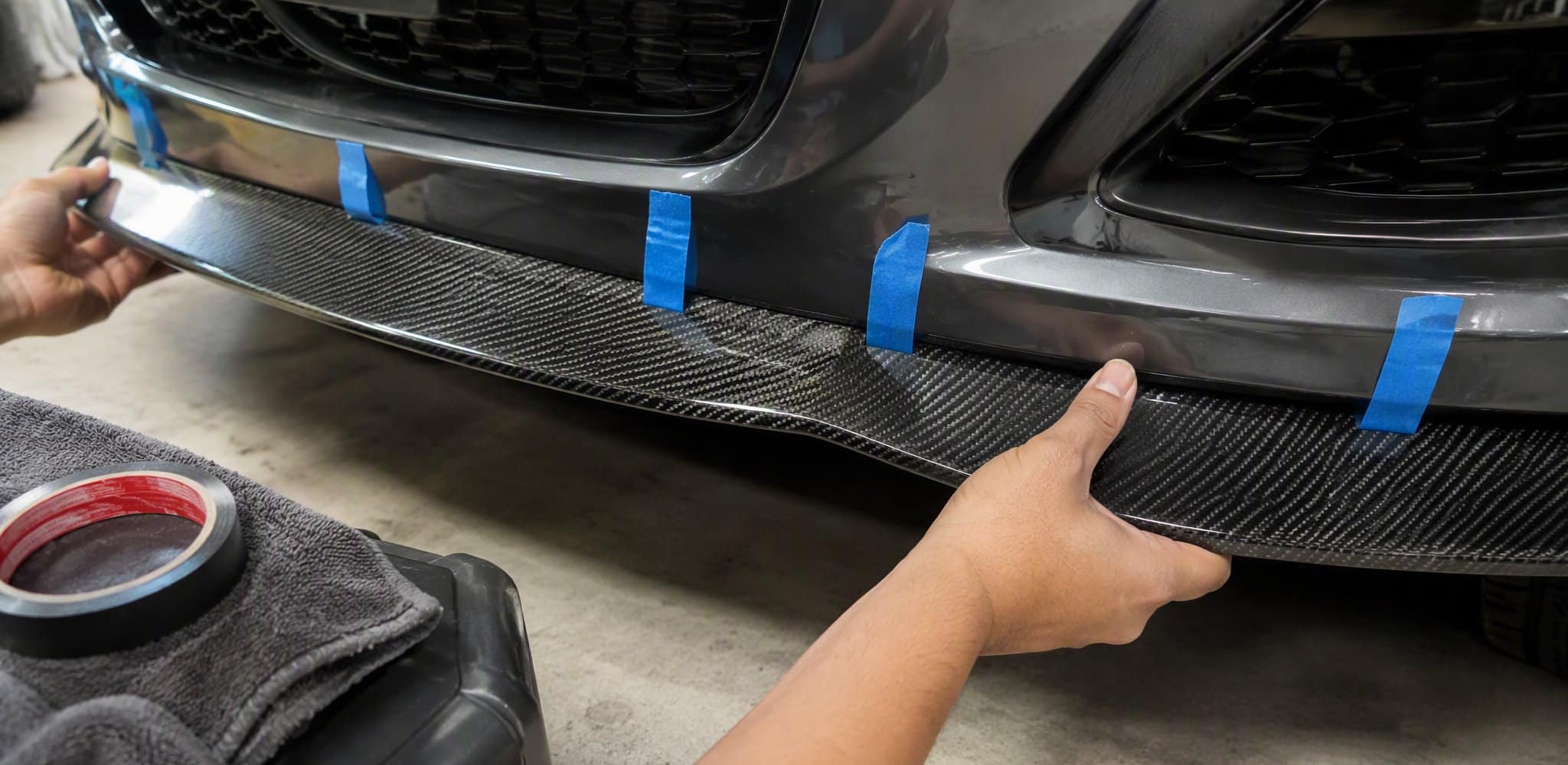 Pressing a carbon fiber front lip onto 3M VHB tape