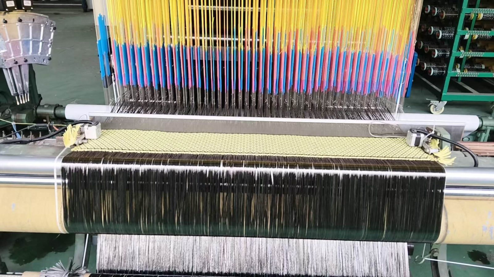 Custom carbon fiber fabric weaving on a JC AutoCarbon loom