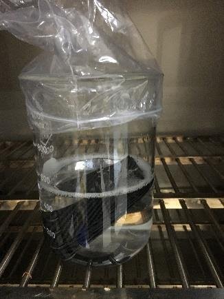 Carbon fiber sample immersed in chemical resistance test