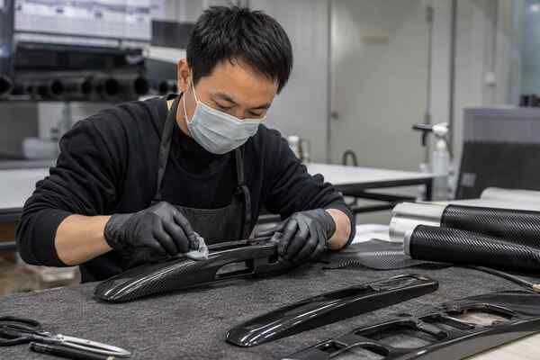 Custom carbon fiber door accessories built on an existing factory mold