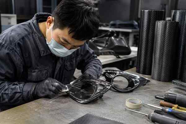 Custom carbon fiber fog lamp covers built on an existing factory mold