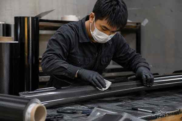 Custom carbon fiber side skirts built on an existing factory mold